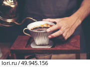 Drip brewing, filtered coffee, or pour-over is a method which involves pouring water over roasted, ground coffee beans contained in a filter. Стоковое фото, агентство Ingram Publishing / Фотобанк Лори