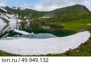 Glacial lake in low clouds in changeable weather. Стоковое фото, фотограф Саблин Станислав / Фотобанк Лори