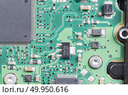 Closeup of electronic circuit board with processor. Стоковое фото, агентство Ingram Publishing / Фотобанк Лори