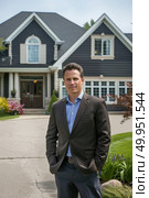 Mature man stands confidently in front of a grand and imposing large house, looking towards the camera. Стоковое AI-изображение, AI-художник Данила Большаков / Фотобанк Лори