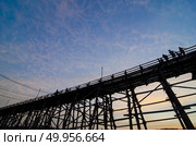 The wooden bridge is the second longest in the world. at Sangklaburi in Kanchanaburi, Thailand. Стоковое фото, агентство Ingram Publishing / Фотобанк Лори