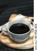 Coffee cup and saucer on old wooden table. Стоковое фото, агентство Ingram Publishing / Фотобанк Лори