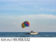PHUKET, THAILAND -Jul 5 2016: An unidentified Paramania Paramotor show in Children day. Photo at Phuket, Thailand. Редакционное фото, агентство Ingram Publishing / Фотобанк Лори
