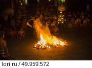 BALI, INDONESIA - JUNE 14: Presentation of traditional balinese Women Kecak Fire Dance on JUNE 14, 2014 on Bali. Kecak (also known as Ramayana Monkey Chant) is very popular cultural show on Bali. Редакционное фото, агентство Ingram Publishing / Фотобанк Лори