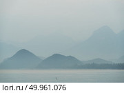 Sunrise and mountain beside the sea at khao sam roi yot national park, Thailand. Стоковое фото, агентство Ingram Publishing / Фотобанк Лори