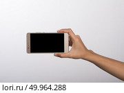 Close Up of a woman holding on mobile phone isolated on white ba. Close Up of a woman holding on mobile phone isolated on white background. Стоковое фото, агентство Ingram Publishing / Фотобанк Лори