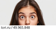 A woman with a surprised expression on her face, eyes wide and mouth slightly open. Стоковое AI-изображение, AI-художник Данила Большаков / Фотобанк Лори