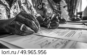 Close-up of an elderly persons hand holding a pen to sign documents on a table. Стоковое AI-изображение, AI-художник Данила Большаков / Фотобанк Лори