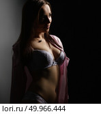 Erotica. Photo of seductive girl posing in dark. Стоковое фото, фотограф Гурьянов Андрей / Фотобанк Лори