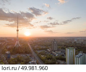 Panoramic view of the city with a TV tower in Kiev, Ukraine on a beautiful sunset. Drone photography from aerial view. view of the city of Kiev with Dorogozhychi distric with a TV tower on sunset. Стоковое фото, агентство Ingram Publishing / Фотобанк Лори