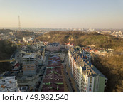 Panoramic view of Vozdvizhenka district with new modern buildings and not completed construction.Lysaya mountain in the springtime Kiev, Ukraine. Panoramic view of Vozdvizhenka district and Bald mountain, Kiev, Ukraine. Drone photography. Стоковое фото, агентство Ingram Publishing / Фотобанк Лори