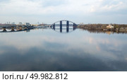 Bridges of Havanskyi and unfinished Podolsk-Resurrection connecting Trukhanov Island and the Troyeshchyna area along the Dnipro River. reflection of the bridge in the water of the river, Ukraine. Photo by drone. unfinished Podolsk-Voskresensky bridge connecting the Truhanov island and the Troyeschina area across the Dnipro River in Kiev. Стоковое фото, агентство Ingram Publishing / Фотобанк Лори