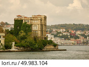 The cityscape with ancient and modern buildings in Istanbul Turkey from the Bosphorus strait on a sunny day with background cloudy sky. Landscape panoramic view from the sea to the historical part of Istanbul, Turkey. Стоковое фото, агентство Ingram Publishing / Фотобанк Лори