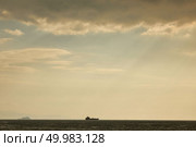 View of the cargo ships, tugboats in the port on the roadstead on the background of cloudy sky.. Landscape panoramic view from the sea to the historical part of Istanbul, Turkey. Стоковое фото, агентство Ingram Publishing / Фотобанк Лори