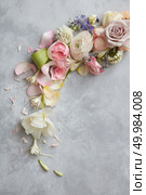 Composition of roses and different flowers over grey background may be used as decoration of any post card or holiday.. Composition of flowers on grey background. Стоковое фото, агентство Ingram Publishing / Фотобанк Лори