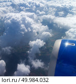 airplane wing aircraft turbine flying jungle bottom white clouds. View of aircraft wing and engines in flight. Стоковое фото, агентство Ingram Publishing / Фотобанк Лори