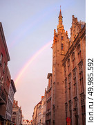 Ancient building and rainbow on Burg Square. Bruges, Flemish Region, Belgium. Bruges City Hall on Burg Square. Стоковое фото, агентство Ingram Publishing / Фотобанк Лори