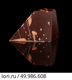 Sideways chocolate candy on a black background. chocolate candy on black background. Стоковое фото, агентство Ingram Publishing / Фотобанк Лори