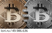 Gold and silver coins bitcoin on a black background. The concept of blockchain technology and money transfers. Mastercard analog concept. Cryptocurrency and blockchain trading concept. Can be used for video or site cove. Two coins bitcoin on a black background money transfer concept. Стоковое фото, агентство Ingram Publishing / Фотобанк Лори