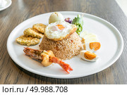 Tiger prawn fried rice with fried egg and salt egg. Стоковое фото, агентство Ingram Publishing / Фотобанк Лори