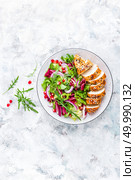 Grilled chicken breast, fillet and fresh vegetable leafy salad with arugula and pomegranate on plate. Grilled chicken breast, fillet and fresh vegetable leafy salad with arugula and pomegranate. Стоковое фото, агентство Ingram Publishing / Фотобанк Лори