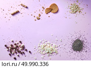 A view from above of a background of natural spices and products for making healthy usefull desserts, for baking, preparing healthy breakfasts on a pink table surface.. Flat lai background from various kinds: wafer croissants, cookies, oat flakes, cereal balls, almond flakes and poppy seeds on a pink surface. Стоковое фото, агентство Ingram Publishing / Фотобанк Лори