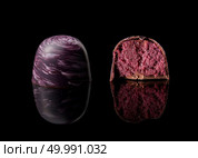 tasty yellow chocolate candy on a black background. chocolate candy on black background. Стоковое фото, агентство Ingram Publishing / Фотобанк Лори