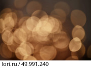 festive bokeh background beautiful yellow christmas lights. golden christmas lights background. Стоковое фото, агентство Ingram Publishing / Фотобанк Лори