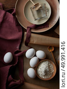 eggs, flour and utensils for cooking, flat lay. ingredients for cooking, Стоковое фото, агентство Ingram Publishing / Фотобанк Лори