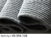Background of the knitted fabric in the fold. Background of the knitted fabric. Стоковое фото, агентство Ingram Publishing / Фотобанк Лори