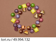 frame of chocolates on a brown background.. Assorted chocolate candies. Стоковое фото, агентство Ingram Publishing / Фотобанк Лори