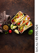 Mexican tacos with chicken meat, vegetables and fresh greens. Стоковое фото, агентство Ingram Publishing / Фотобанк Лори