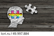Inside autism concept of autistic development disorder awareness as a symbol of a communication and social behavior psychology as crumpled paper on rustic wood in a 3D illustration style. Стоковое фото, агентство Ingram Publishing / Фотобанк Лори