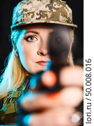Portrait of attractive woman in military style. Стоковое фото, агентство Ingram Publishing / Фотобанк Лори