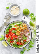 Healthy and delicious bowl with buckwheat and salad of chickpea, fresh pepper and lettuce leaves. Dietary balanced plant-based food. Vegan and vegetarian dish. Top view. Flat lay. Стоковое фото, агентство Ingram Publishing / Фотобанк Лори
