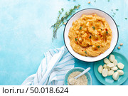 Hummus with chickpea and tahini, delicious and healthy protein vegan and vegetarian food, top view, flat lay. Стоковое фото, агентство Ingram Publishing / Фотобанк Лори