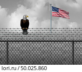American eagle on security border as an illegal or legal immigration and customs barrier or government shutdown concept with a United States flag with 3D illustration elements. Стоковое фото, агентство Ingram Publishing / Фотобанк Лори