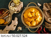 Chicken masala curry, spicy meat. Yellow chicken curry sauce. Spicy chicken curry dish. Traditional indian food, asian cuisine. Top view. Стоковое фото, агентство Ingram Publishing / Фотобанк Лори