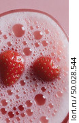 Two strawberries floating on a pink sparkling drink. Стоковое AI-видео, аниматор Юрий Поздников / Фотобанк Лори