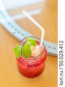 iced lychee fruit juice smoothie cocktail and mocktail on glass table. Стоковое фото, агентство Ingram Publishing / Фотобанк Лори