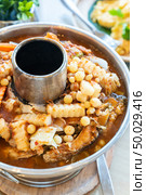 Sour curry soup with fried fish and seafood fish egg with mix vegatable, traditional thai food cuisine. Стоковое фото, агентство Ingram Publishing / Фотобанк Лори