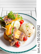 grilled beef skewer with fried rice. Стоковое фото, агентство Ingram Publishing / Фотобанк Лори