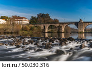 Bridge of Ponte da Barca, ancient portuguese village, on Minho river, north of Portugal. Стоковое фото, агентство Ingram Publishing / Фотобанк Лори
