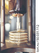 coffee make concept with Drip brewing, filtered coffee or pour-over is a method which involves pouring hot water over roasted bean coffee , ground coffee beans contained in a filter old tradition. Стоковое фото, агентство Ingram Publishing / Фотобанк Лори