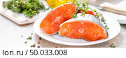 Fresh raw salmon fish steaks on white kitchen background. Banner. Стоковое фото, агентство Ingram Publishing / Фотобанк Лори