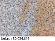Texture gray granite. Smooth light stone texture. Uniform surface with stone grinding. Gray stone with dark inclusions. Material for decoration, background texture, interior design. Стоковое фото, агентство Ingram Publishing / Фотобанк Лори