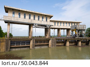 GALI, ABKHAZIA - MAY 18, 2025: Water discharge sluices on the Gali hydroelectric power station dam. Стоковое фото, фотограф Виктор Карасев / Фотобанк Лори