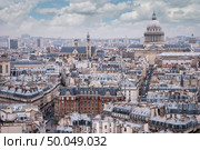 top view of one of the towers of Notre Dame . In the background is seen Pantheon of Paris.. top view on Paris . Стоковое фото, агентство Ingram Publishing / Фотобанк Лори