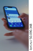 Scrolling through social media messages on smartphone in closeup hand view. Стоковое AI-видео, аниматор Владимир Федоров / Фотобанк Лори