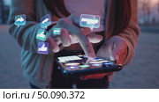 Interactive augmented reality icons hover above smartphone in modern technology scene. Стоковое AI-видео, аниматор Владимир Федоров / Фотобанк Лори